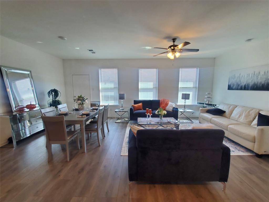 Cozy living room opens to kitchen and morning area