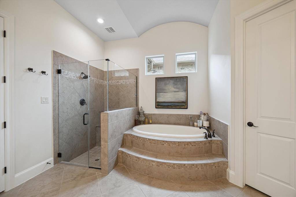 Primary Bath featuring walk-in shower and soaking tub.