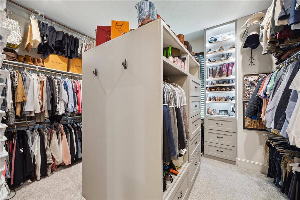Primary closet with custom built-ins.