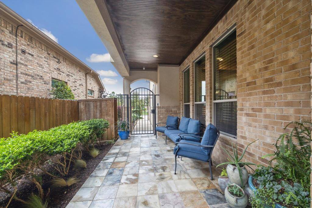Expansive covered entry with stained bead board ceiling.