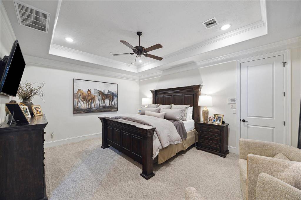Elegant Primary Bedroom with tray ceiling.