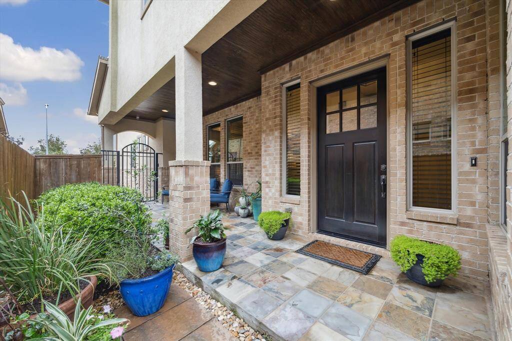 Entry with 8' tall custom Mahogany, oversized front door.