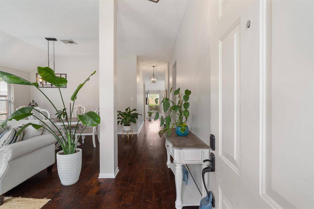 ENTRY WITH FORMAL LIVING AND DINING ROOMS, FRESHLY PAINTED WALLS AND CEILINGS, ENGINEERED WOOD FLOORS