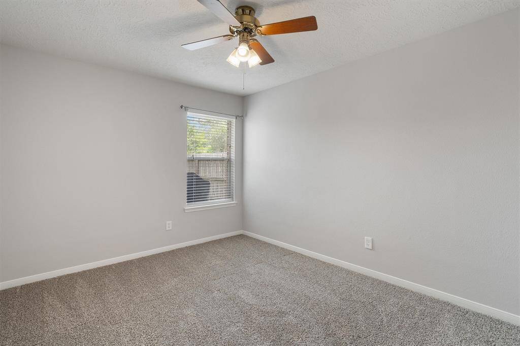 BACK SECONDARY BEDROOM (ATTACHES TO SIDE SECONDARY BEDROOM THROUGH SHARED BATHROOM)