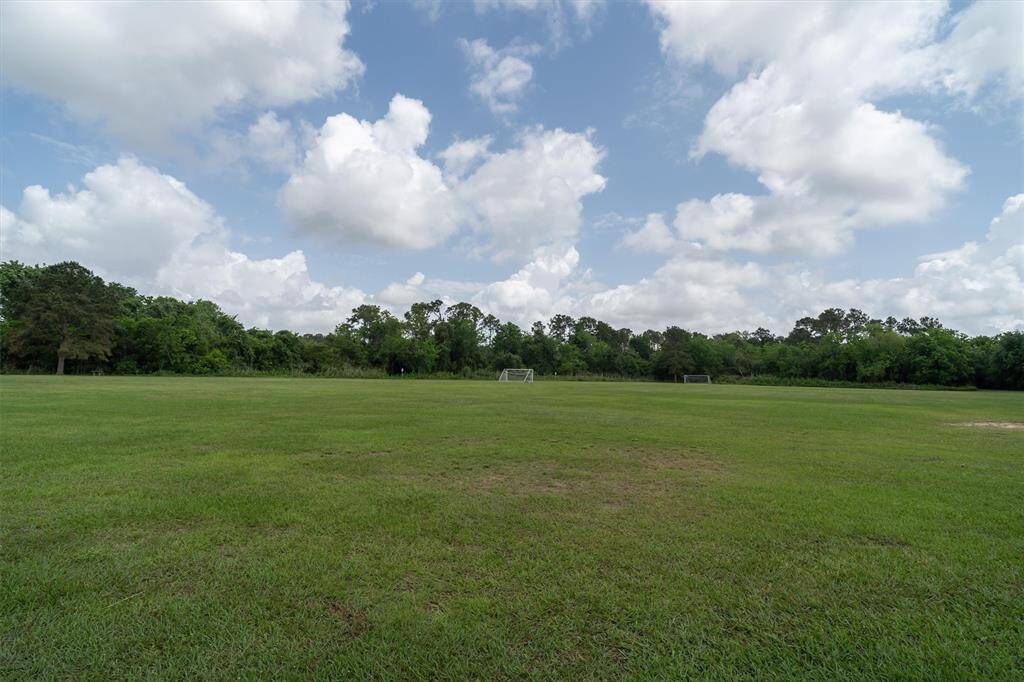 TAKE A WALK THROUGH THE TRAILS THAT LEAD TO AND GO AROUND A NEIGHBORHOOD POND WITH FISHING PIER