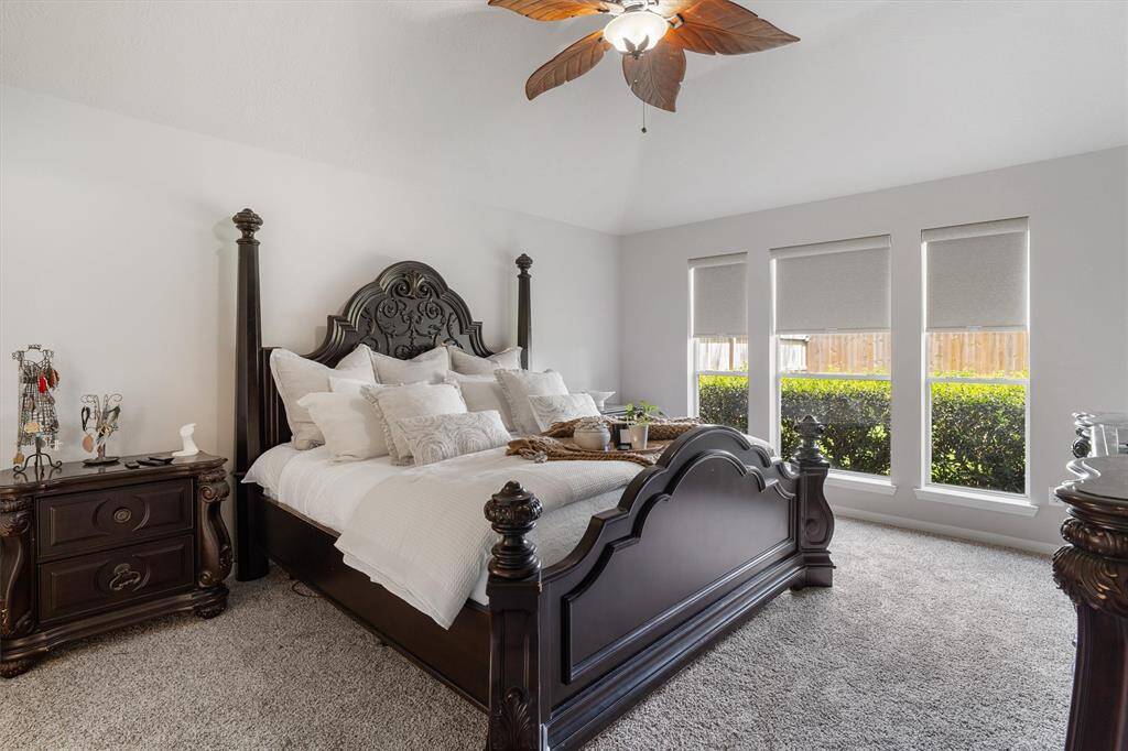 LIGHT AND BRIGHT MASTER BEDROOMN SPLIT FROM SECONDARY BEDROOMS FACING BACKYARD. CUSTOM BLACKOUT SHADES