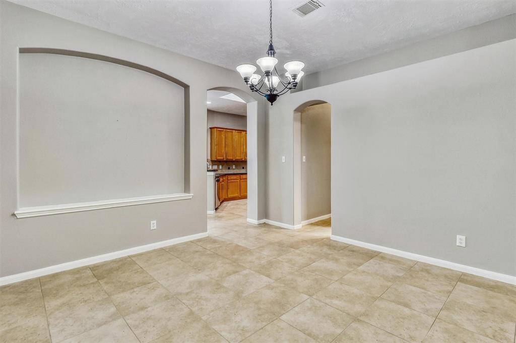 There's ample space for a large dining table and chairs, making this area ideal for hosting family gatherings and special occasions.