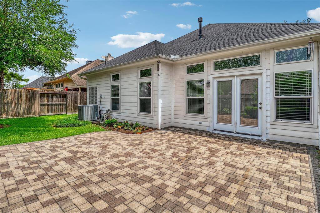 Step outside to your private oasis, complete with a spacious paver patio—perfect for outdoor relaxation and entertaining. There’s ample room to accommodate your favorite outdoor seating set.