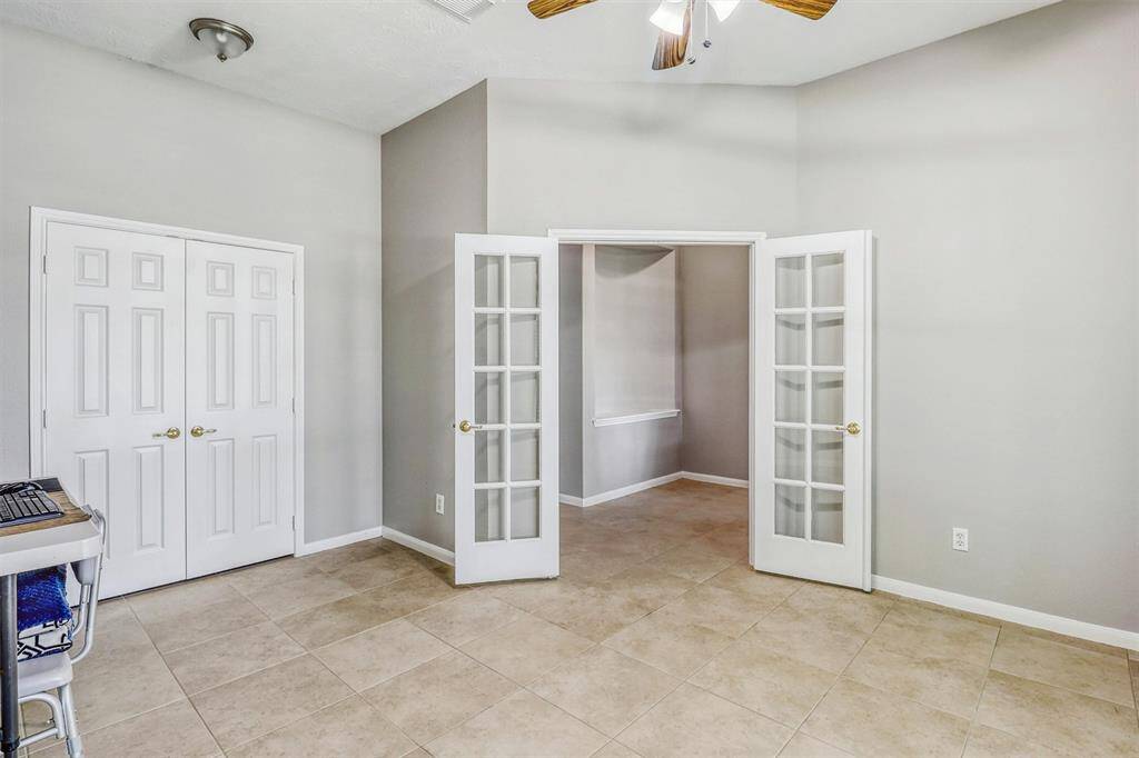 With a reach-in closet and a ceiling fan, this versatile space could easily serve as a home office, workout room, or additional bedroom.