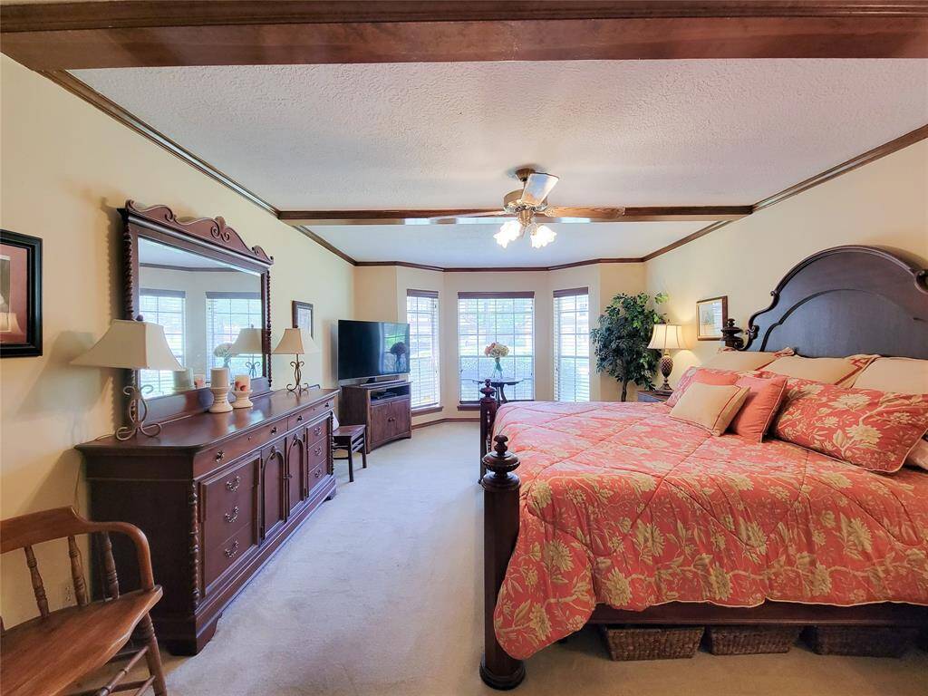 Primary bedroom features a lovely bay window. Perfect for a reading nook.