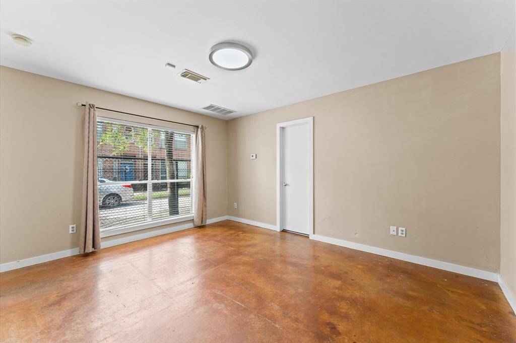 First-floor bedroom with stylish epoxy floors.
