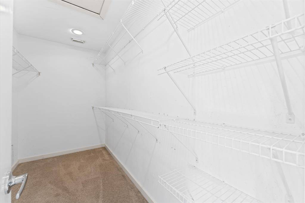 Large walk-in closet with plenty of storage.