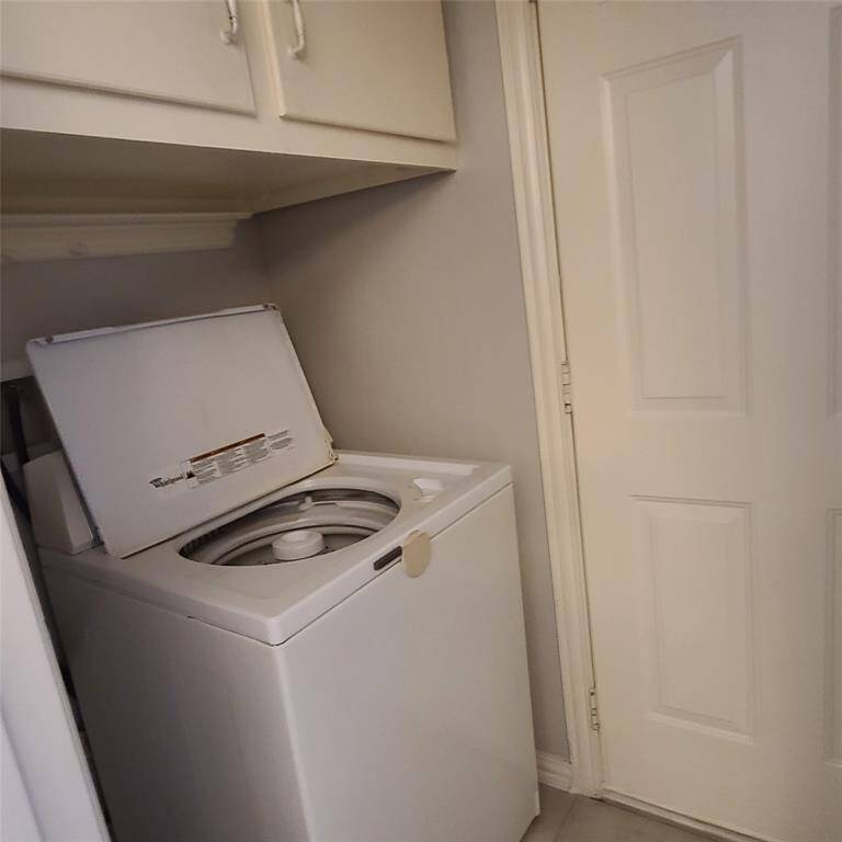 Utility room with washer, dryer & storage cabinets