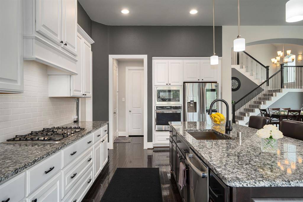 Another view from the kitchen - lots of storage. The door ahead is the pantry, the door on the left leads to the garage, and the door on the right (not pictured) leads to the laundry room - all conveniently accessible from the kitchen.