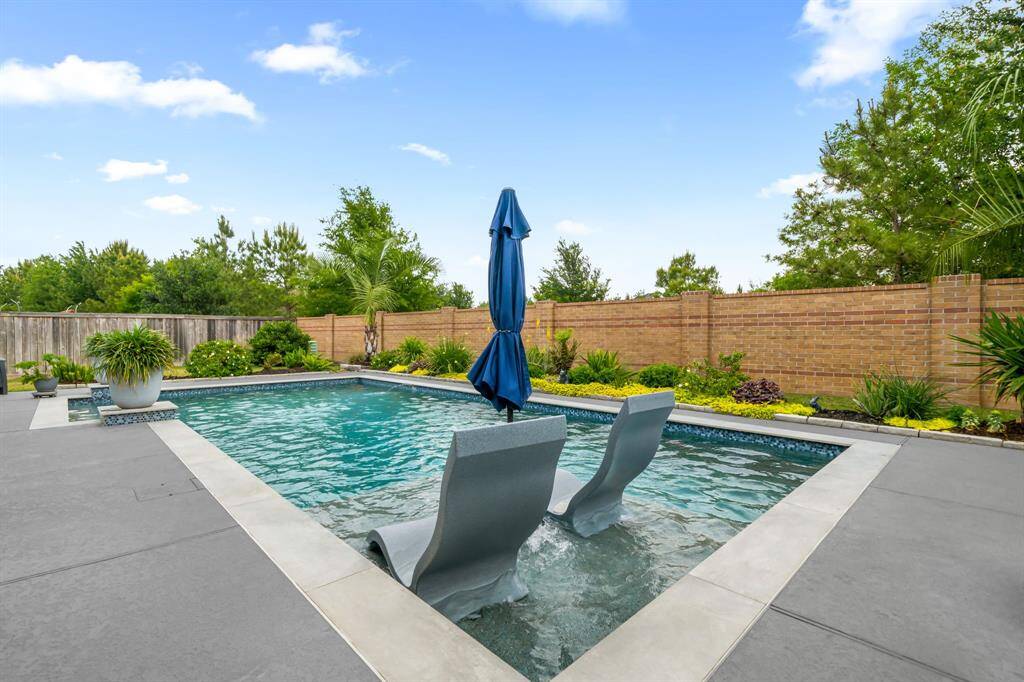 The pool deck is finished off with a knockdown finish with a slip-resistant offering. The pool deck was just refinished and sealed. Lots of deck space for lounging, cocktail parties, or family fun.