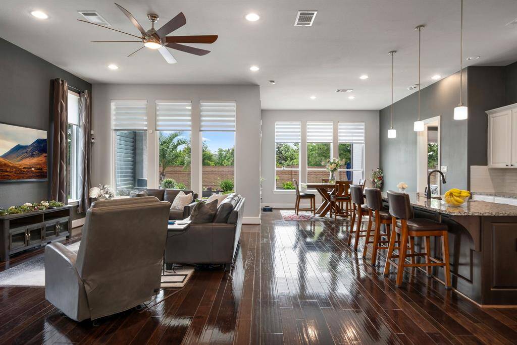 View to the outdoors from the living room and the breakfast area. The kitchen is open to the living room for easy entertainment.