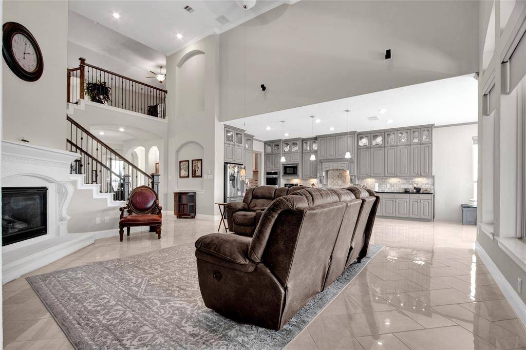 This elegant living room seamlessly combines style, warmth, and practicality for both entertaining and relaxation.