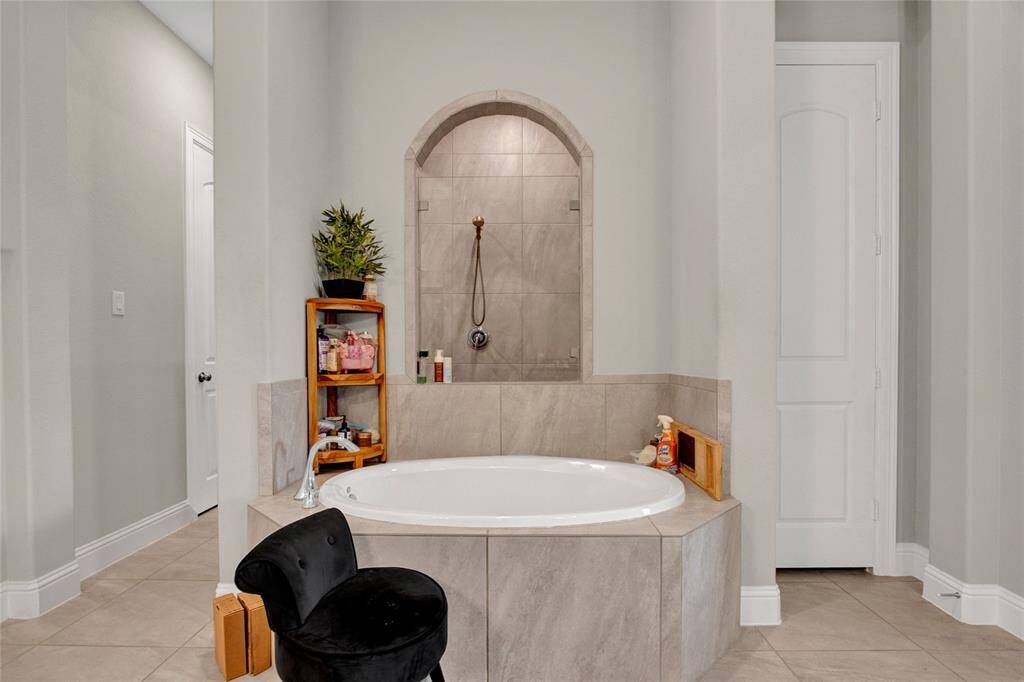 Experience spa-like serenity in this elegantly designed primary bathroom.