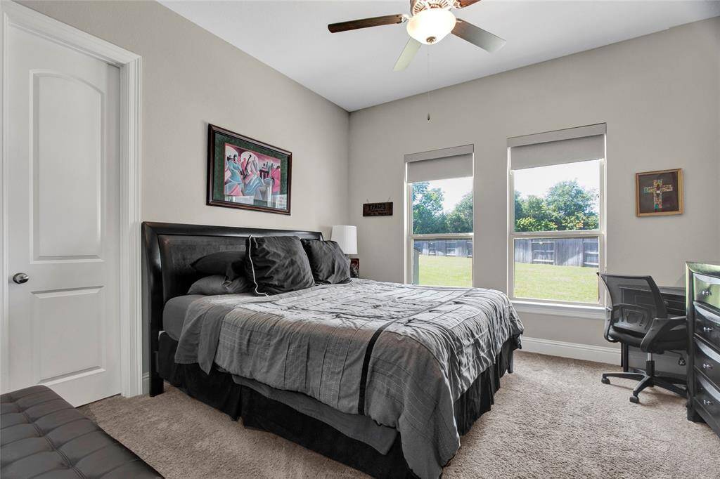 Cozy downstairs bedroom with abundant natural light.