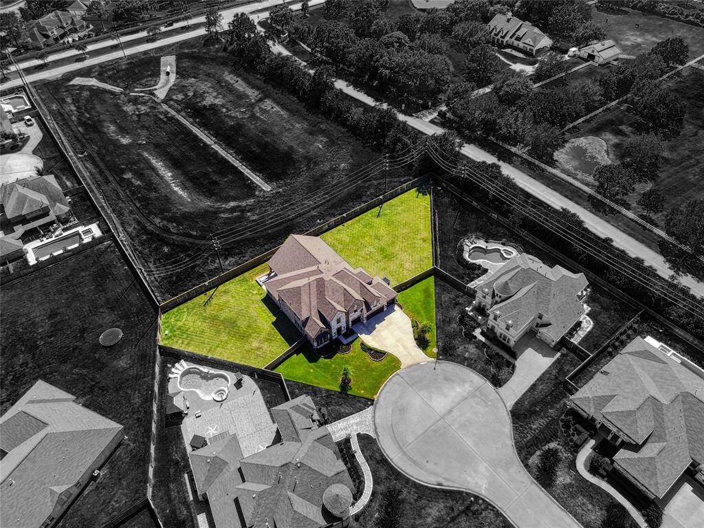 Discover unparalleled privacy and prestige on this expansive 26,000+ sq ft lot.