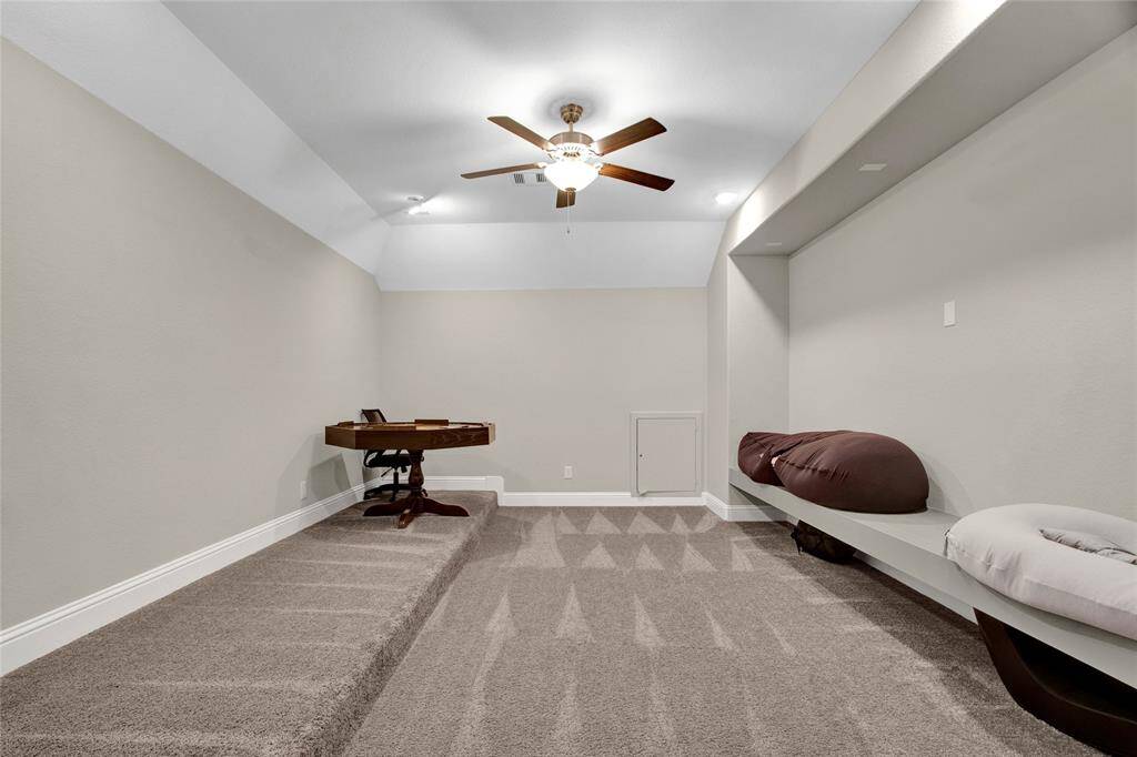 Enjoy unforgettable movie nights and sports events in this spacious media room!
