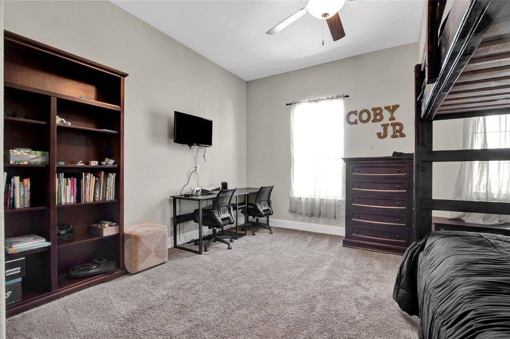 Cozy upstairs bedroom with ample space for relaxation and study.