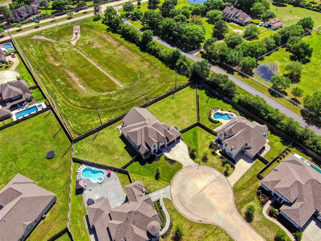 Expansive aerial view showcasing this stunning property.