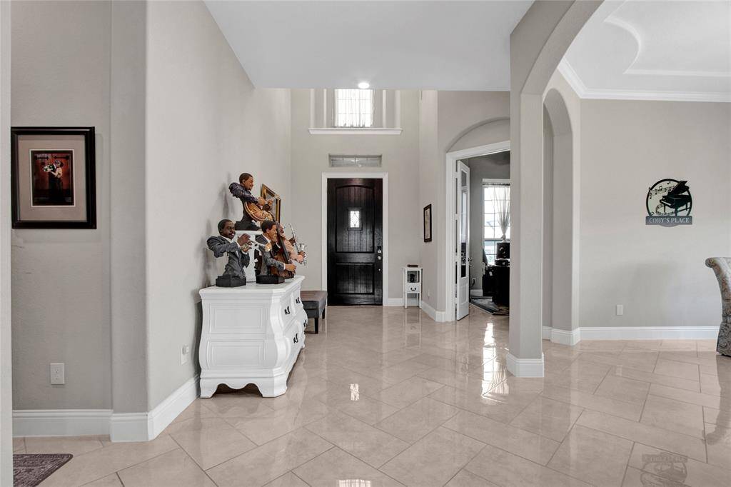 Elegant foyer with high ceilings and inviting natural light.