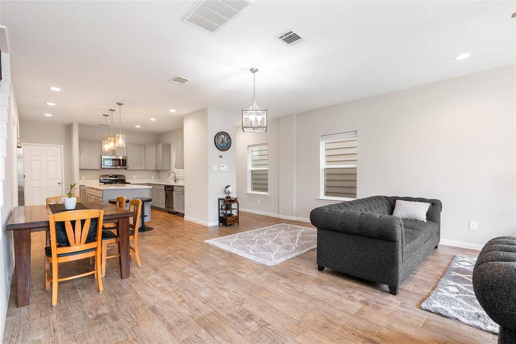 Entertain with easy in this open concept living design! Easy to maintain tile flooring elegantly flows throughout this stunning living space!