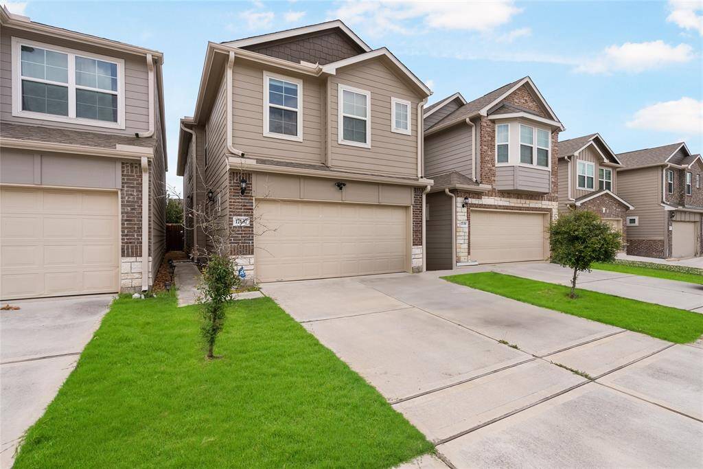 This charming brick and wood exterior also offers great parking space with an attached two car garage and double-wide driveway!