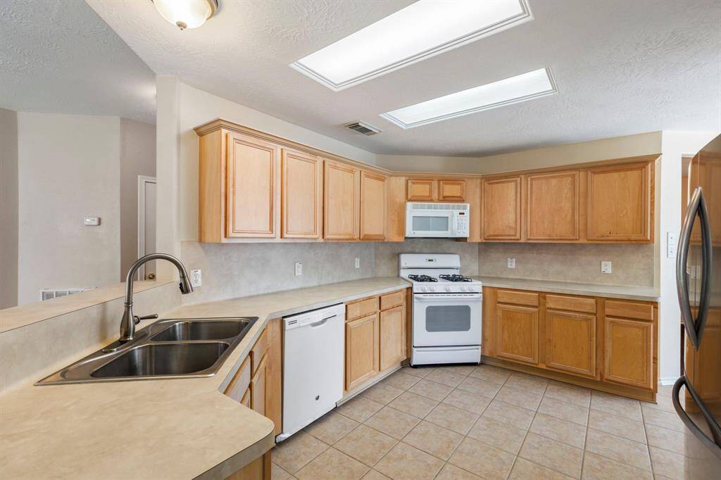 Spacious kitchen with tons of counter and cabinet space.