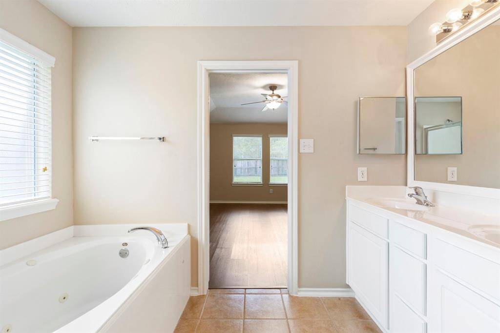 The primary bathroom also boasts a large walk-in closet.