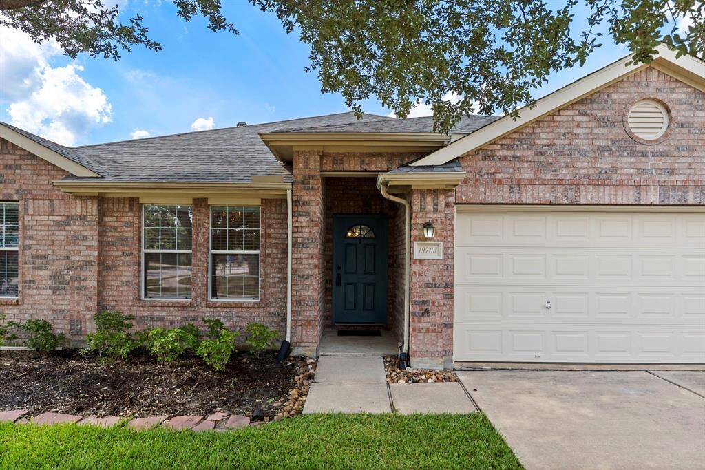 Low maintenance landscaping welcomes your friends and family.
