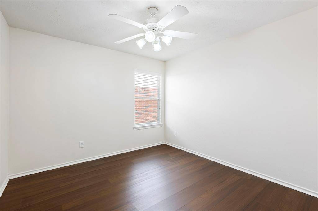 One of two secondary bedrooms on the other side of the home.
