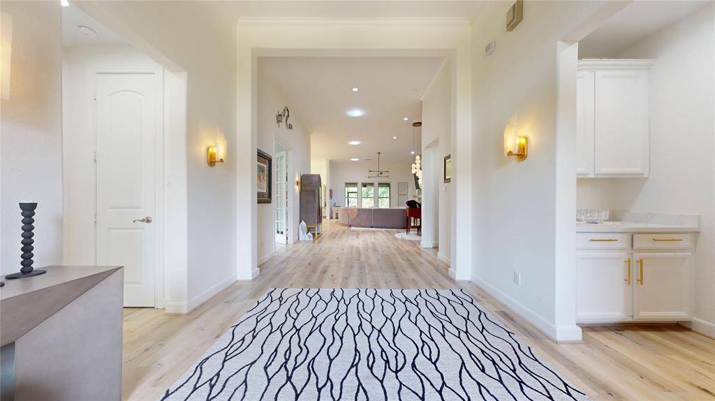 The wood slats are carried though the home in this floor to ceiling feature wall