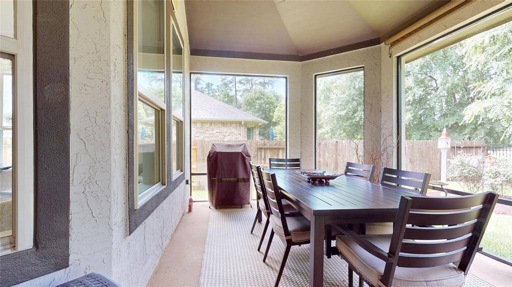 Beautiful yard with paver walkways and lots of trees.