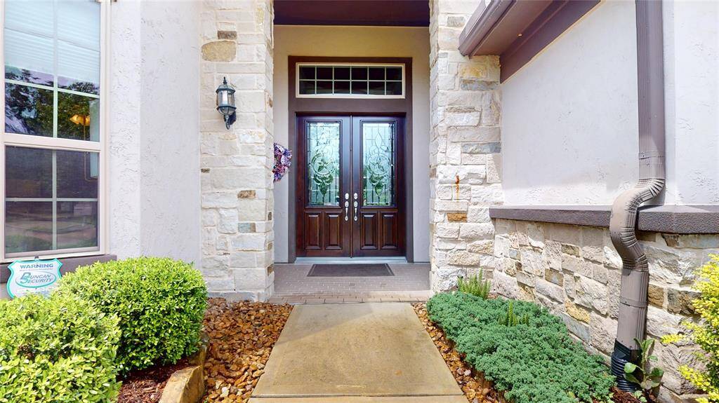Double doors to this gorgeous home