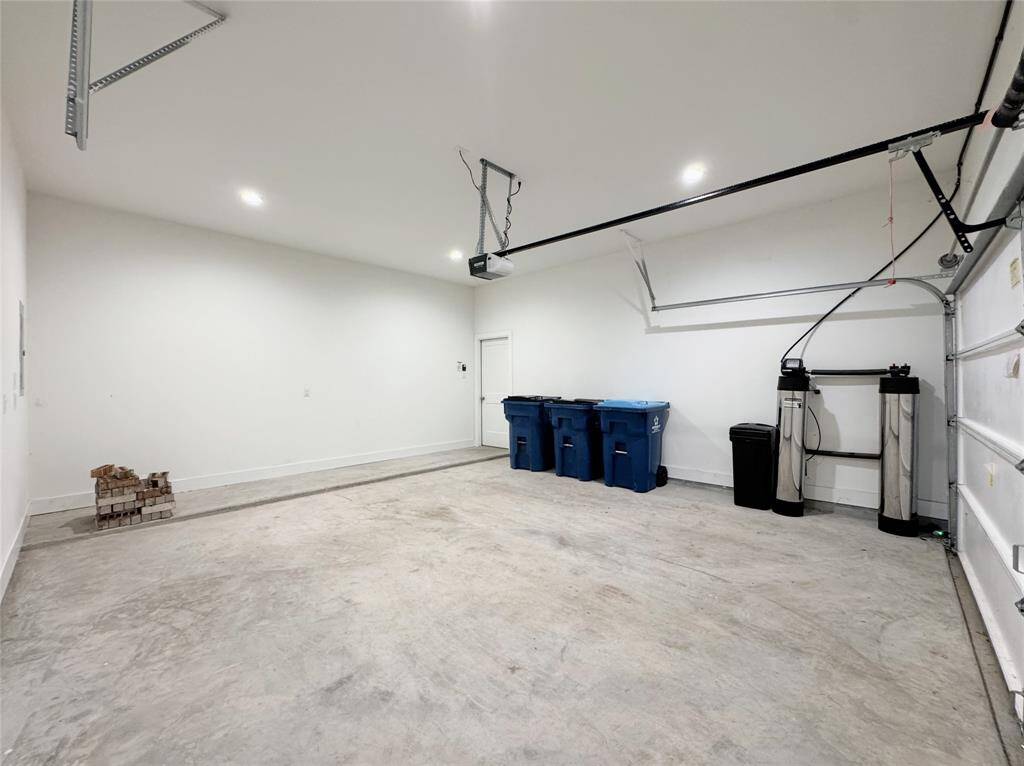 Spacious Garage with Water Softener Installed