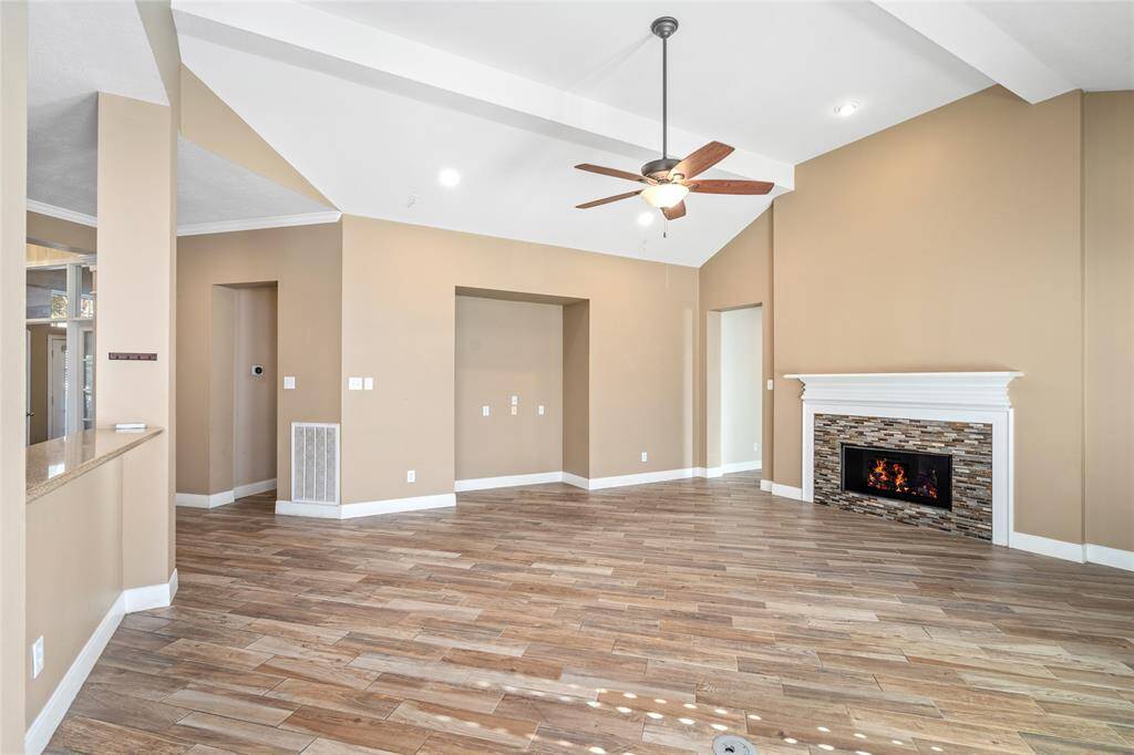 The centerpiece of this room is the beautifully updated fireplace, which adds warmth and character to the space. With its modern design and stylish finish, it serves as a focal point that enhances the room’s inviting atmosphere, perfect for cozy gatherings or quiet evenings.