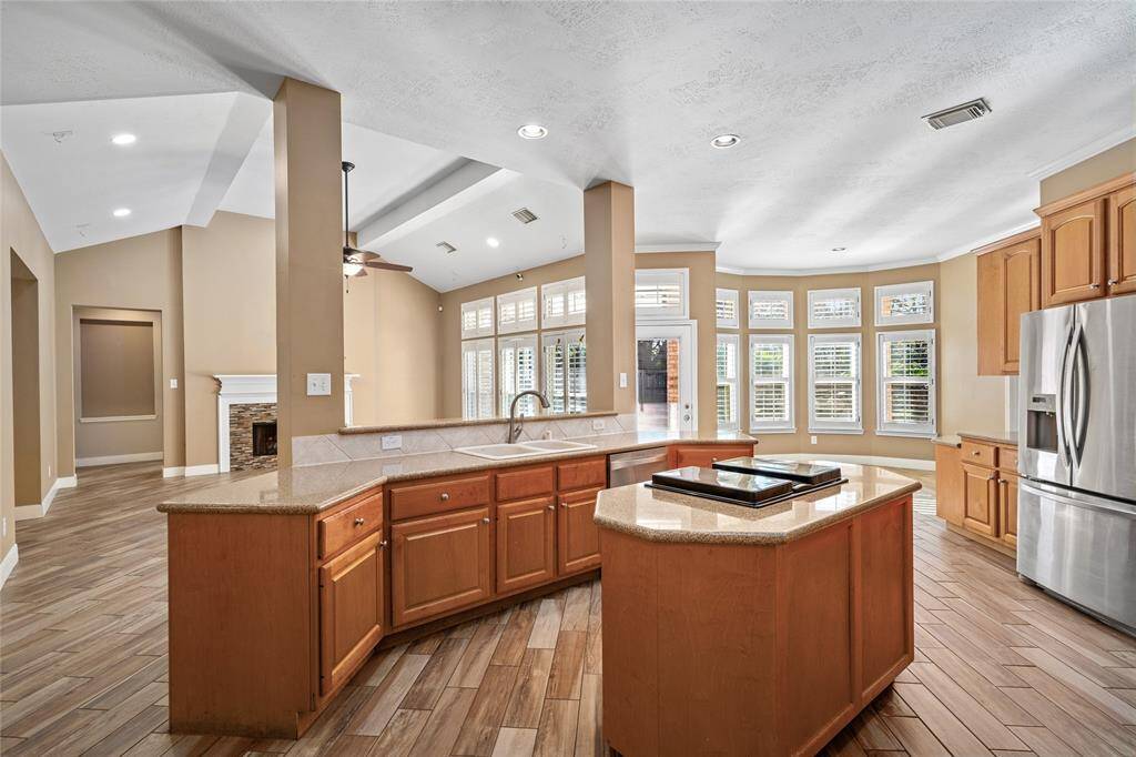 The kitchen, the heart of the home, is both spacious and functional, featuring updated fixtures that blend style with practicality. Equipped with a dishwasher, disposal, electric stove, and microwave, it offers all the essentials for modern living. The pantry provides ample storage, making it easy to keep everything organized and accessible, while the open layout ensures you’re always part of the action.
