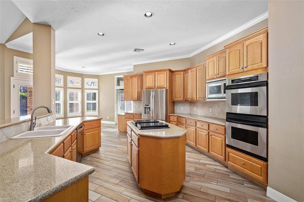 The kitchen, truly the heart of the home, is a spacious and inviting area designed for both convenience and style. With updated fixtures, a dishwasher, disposal, electric stove, and microwave, this kitchen offers all the modern amenities you need. The pantry provides plenty of storage, ensuring everything has its place while you enjoy easy access to your essentials.