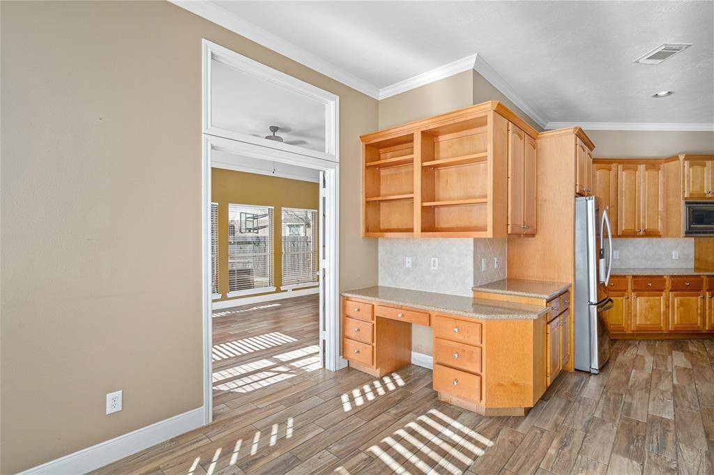 This room opens up to another versatile space, ideal for a second living room or family room, offering plenty of room to relax and entertain. With direct access to the backyard and pool, it seamlessly blends indoor and outdoor living, making it perfect for gatherings or enjoying the outdoors at your leisure. ***The Sunroom was repainted to the neutral paint color***