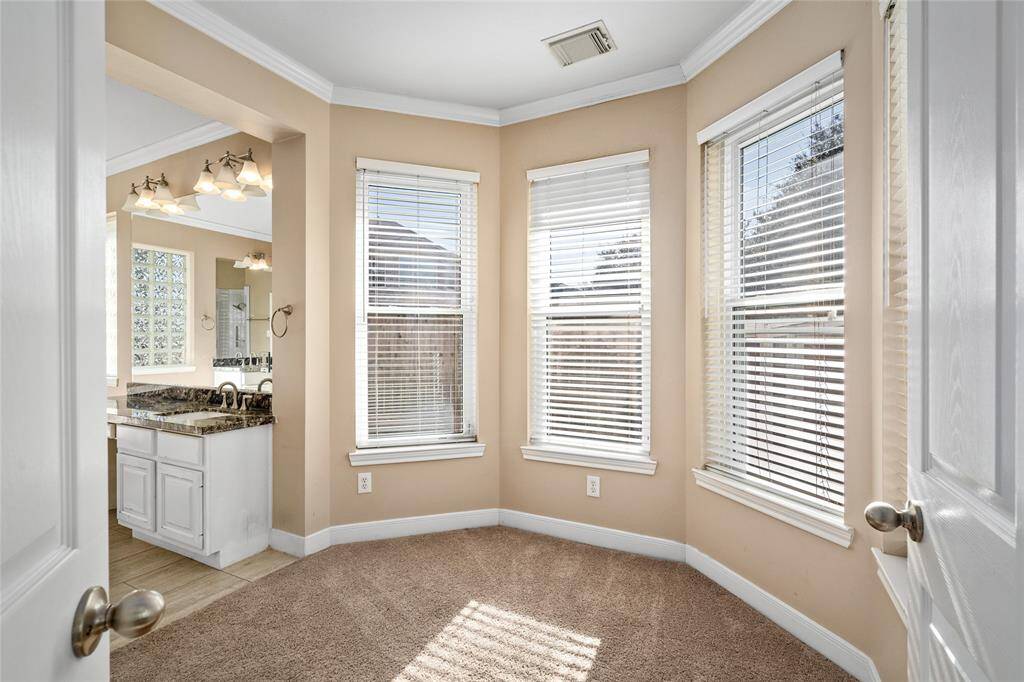 The primary suite includes a charming bonus room, offering endless possibilities for use. Whether you envision it as a cozy reading nook, a creative crafting space, or a dedicated exercise area, it provides the flexibility to suit your lifestyle and needs.