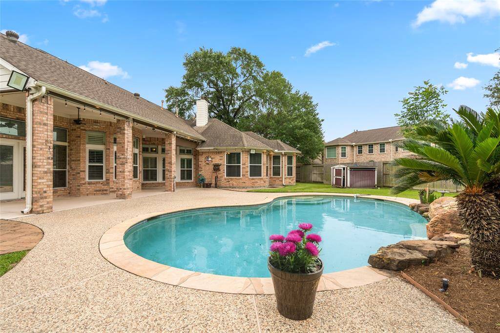 The pool, while ideal for family fun and entertainment in warmer months, still adds charm to the home during the winter. It can be enjoyed from the cozy back porch or used for a brisk winter dip. Its presence enhances the outdoor space year-round, providing a tranquil view during colder months.