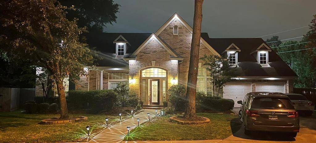 The home features exterior lighting that enhances its curb appeal while providing added security and visibility. Perfect for evening gatherings or simply enjoying the outdoors after sunset, the lighting creates a warm and inviting atmosphere.