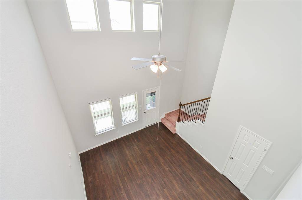 Here we are on the 2nd 'game room' floor, facing a wide wall cut out, with a view of the living area, below.