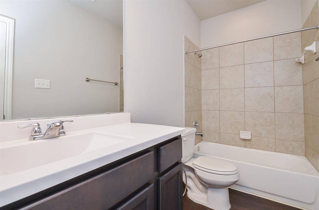Don't you love the over sized tile surround in this bathroom?