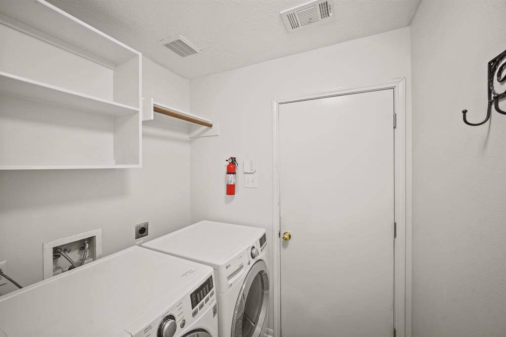 Laundry room with washer and dryer