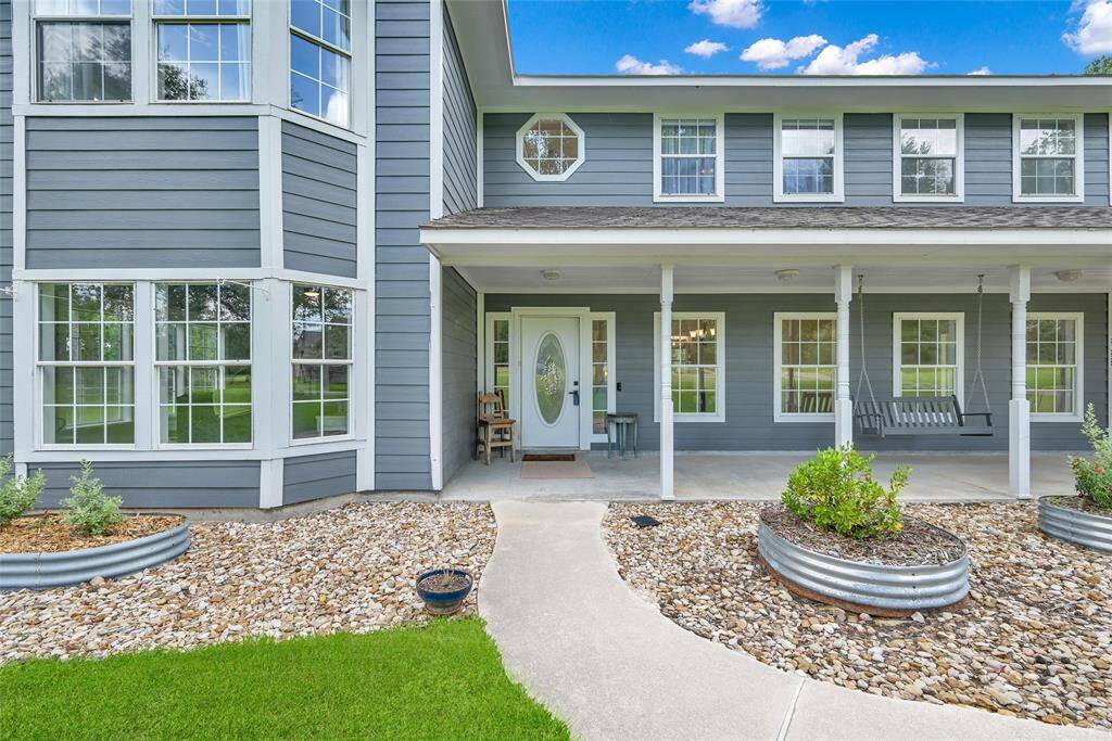 A closer look at the welcoming front porch—ideal for morning coffee, afternoon chats, and lazy weekend rocking chair vibes.