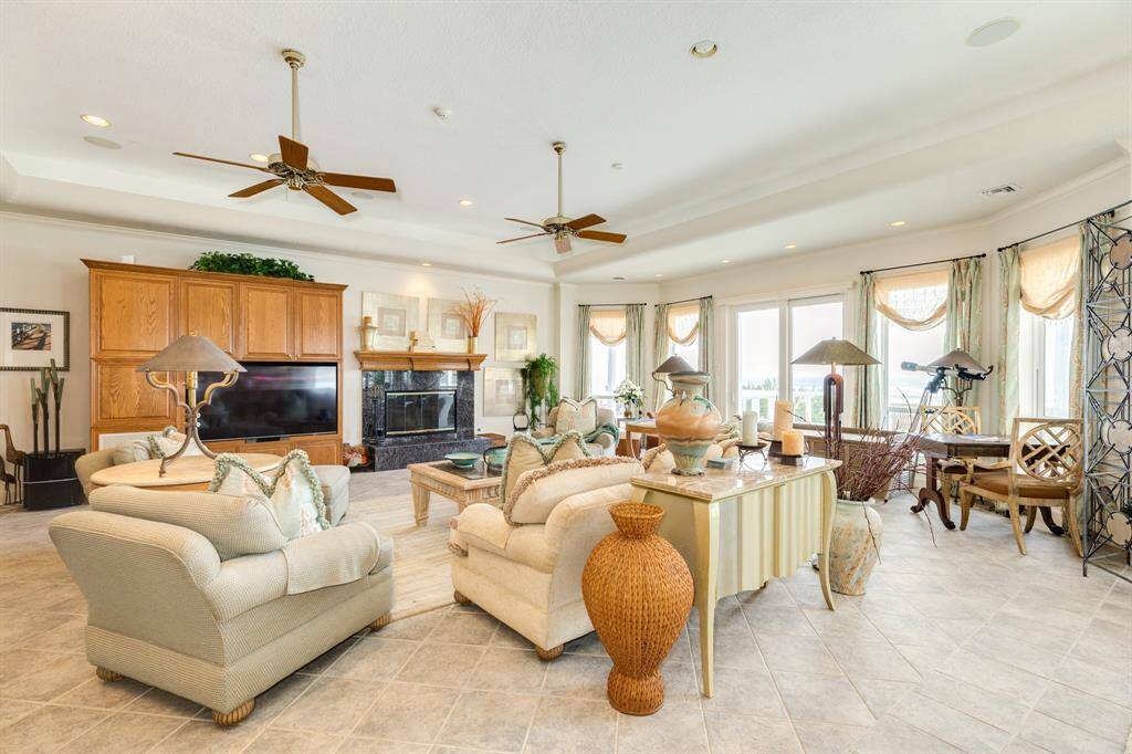 There are two doors leading out to the main deck, one in the living room and the other in the dining area.
